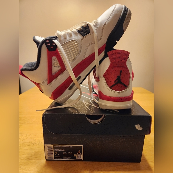 Youth Size 7 Nike Air Jordon 4 Retro shoes. Red white and black.